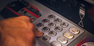 A picture of a person at an ATM