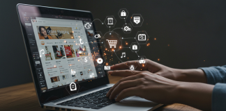 A laptop displays icons of different social media channels